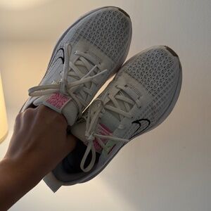 Nike running interact sneakers in white and black